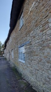Row of thatched houses built as accomodation for castle staff