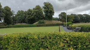 Behind the bowling green in Priory Park