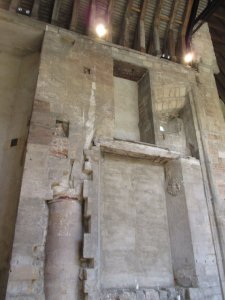 Inside the priory church, a column and archway were hidden during Tudor renovations