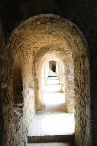 The upstairs passageway cut through the stone wall