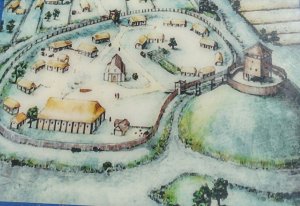 Drawing of the early castle with wooden buildings, taken from an info board near the castle site.
