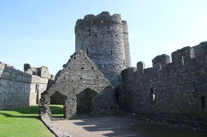 The north west tower with the ruins of the stables in the foreground