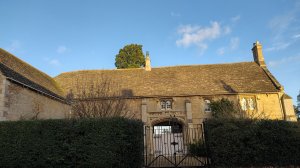 House built by Edward IV as extra lodgings for castle visitors, with Yorkist heraldry still in evidence over the entrance