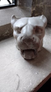 A gargoyle head on display