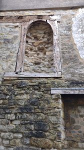 A blocked up window or another niche for statues?