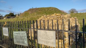 The motte visible behind the protected castle masonry