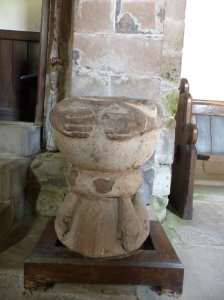 A carved water stoup