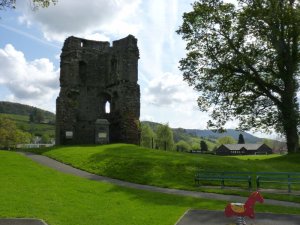 The remains of the castle amongst the childrens play equipment