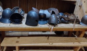 A display of medieval helmets for kids to try on!