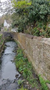 The gatehouse is situated right by the side of the River Trym