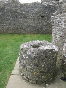 A stone plinth which once supported a hearth