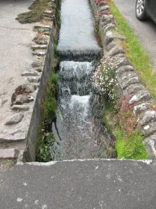 Picturesque stream in the village High Street