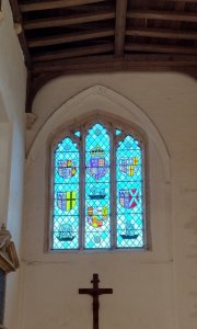 The York Window in the church. This depicts Richard III, his wife Anne and his father-in-law Warwick the Kingmaker. Richard's white boar is in the middle of the second row