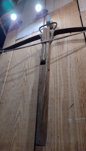 A longbow, rather menacingly placed on the wall of the cafe