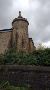 One of the ancient turrets with a modern day building incorporated into the same wall