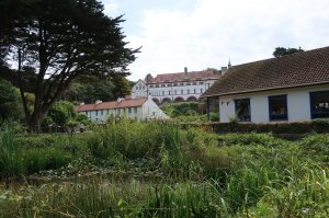 The abbey viewed over the village pond