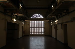 The large window at the end of the prison corridor