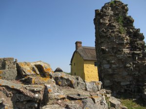 Fragments of the castle wall with the house behind