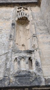 An empty statue niche, would have once contained a statue of Mary